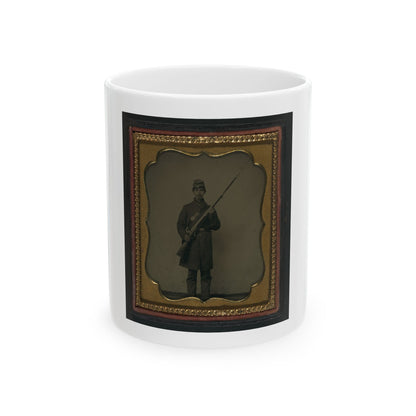 Antique tintype of a Civil War infantryman standing with a musket and bayonet, in a scalloped gilt case.