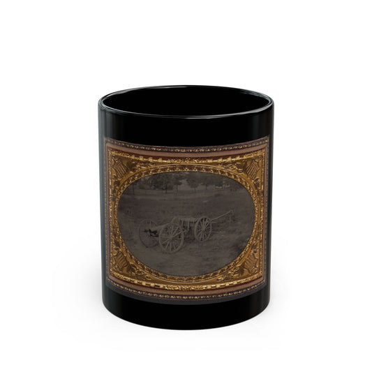 Monochrome tintype of a cannon and limber on open grass, in an oval vignette within a gilt embossed case.