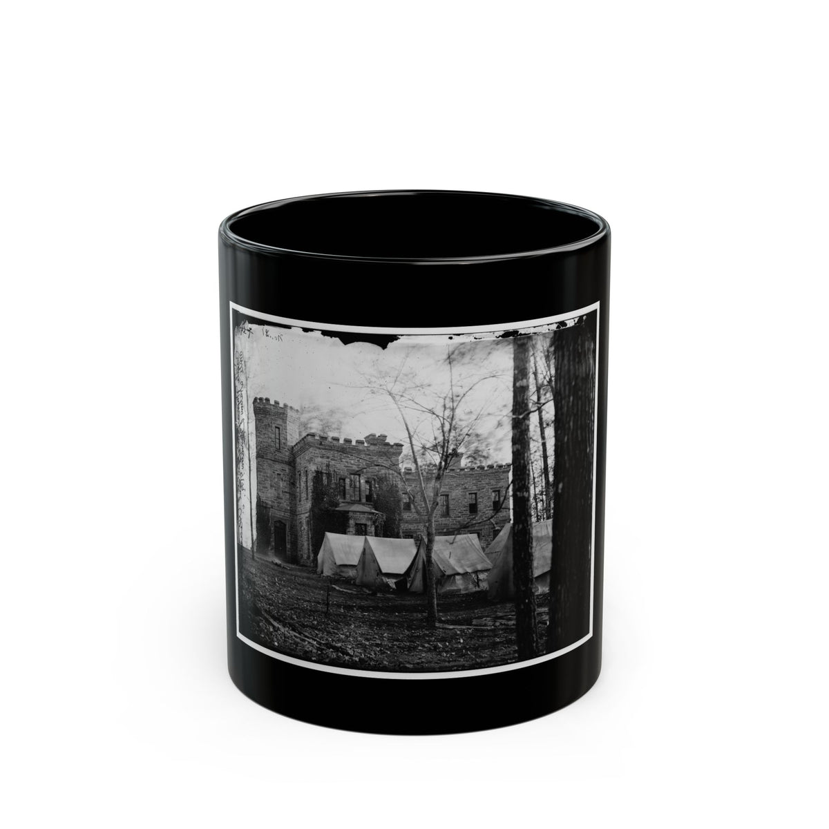 Black and white 19th-century view of a stone castle-like building with canvas tents and bare trees in front.