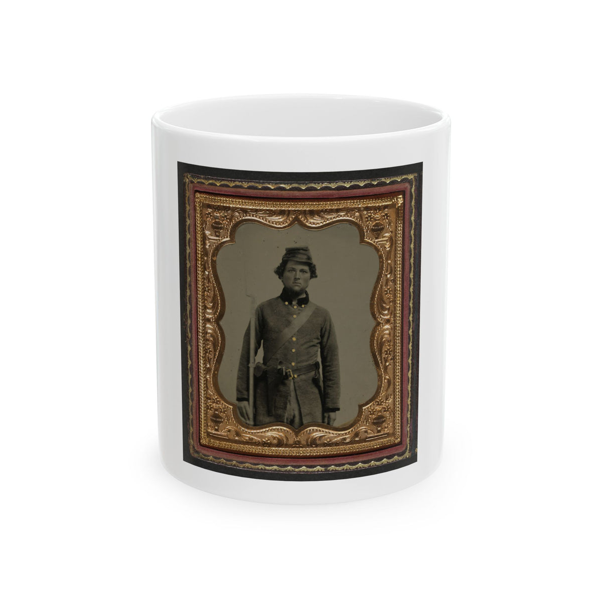 Sepia tintype of a standing soldier in a kepi with a rifle, set in an embossed gold scalloped frame inside a case.
