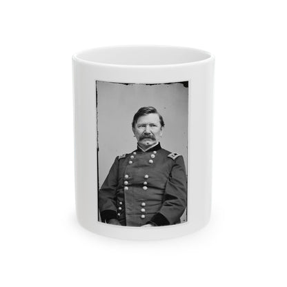 Black and white 19th-century portrait of a mustached man in a dark double-breasted uniform, facing the camera.