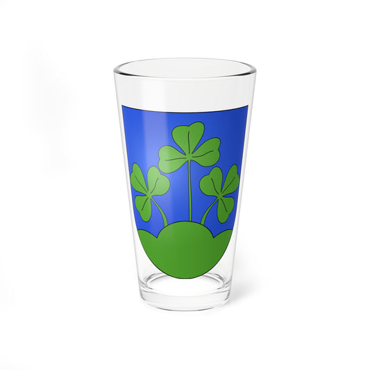 Three green clover sprigs rise from a green mound on a blue heraldic shield with soft gradient shading.