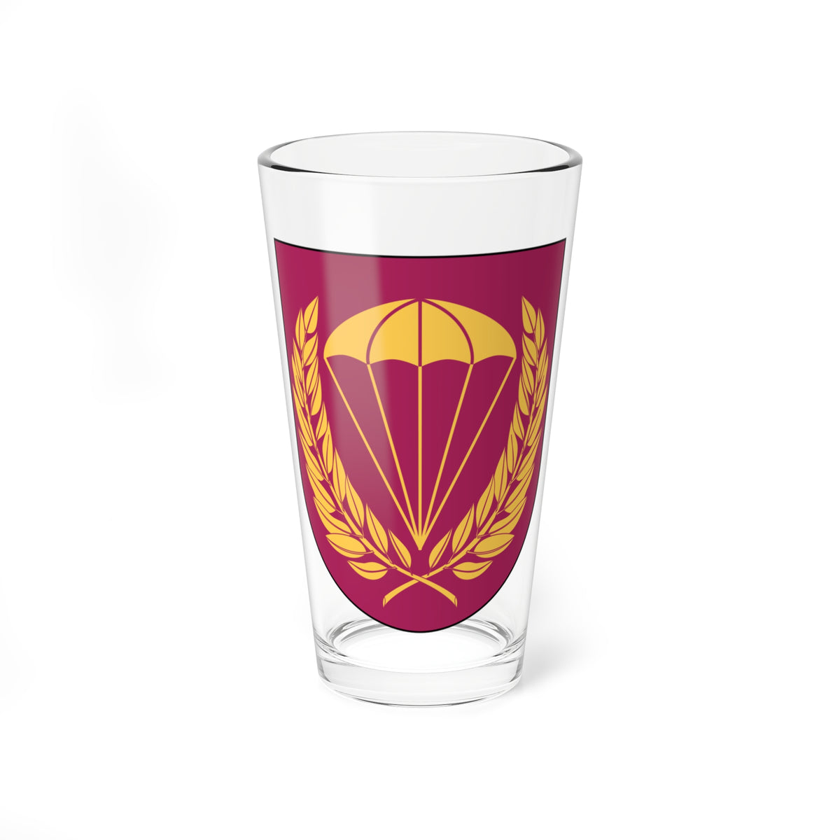 Gold open parachute above a gold laurel wreath with crossed stems on a maroon heraldic shield.