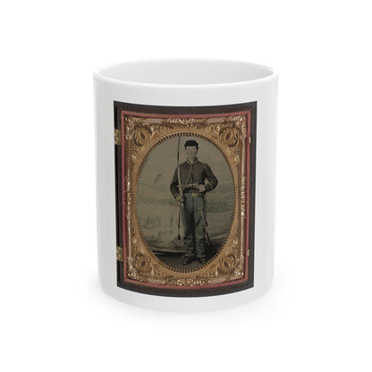 Hand-tinted portrait of a standing young soldier with a sabre before a painted army camp, set in an oval gilt case.