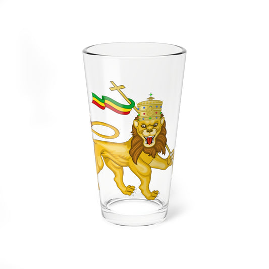Gold crowned lion walking while holding a cross-topped staff with a red, yellow and green flag.