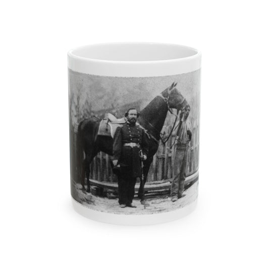 Black and white study of a bearded officer with a sword beside a saddled dark horse, with a picket fence behind.