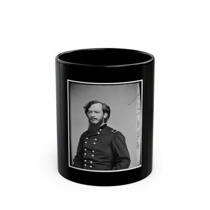 Black-and-white vintage portrait of a bearded man with long hair in a double-breasted military uniform.