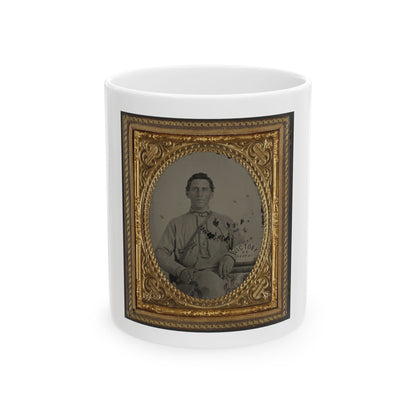 Antique tintype of a seated man in a light jacket, in an ornate gilt oval case with a paper label reading Victory or Death.