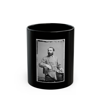 Black and white 19th-century portrait of a bearded man in a double-breasted coat, seated in a tasselled chair.