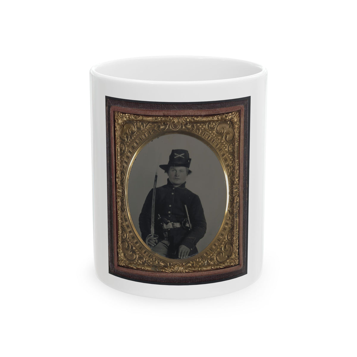 Monochrome tintype of a Civil War soldier with a sabre and crossed-sabre hat badge, set in an ornate gilt frame.