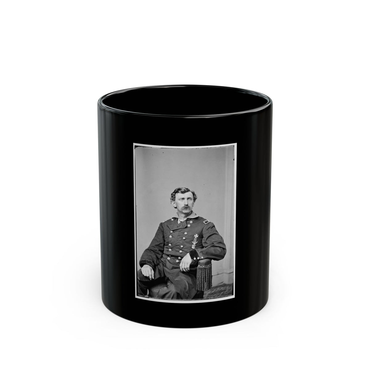 Black and white 19th-century studio portrait of a seated, moustached officer in a military coat with brass buttons.