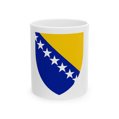 Blue and gold shield split diagonally, with six white five-pointed stars along the dividing line.