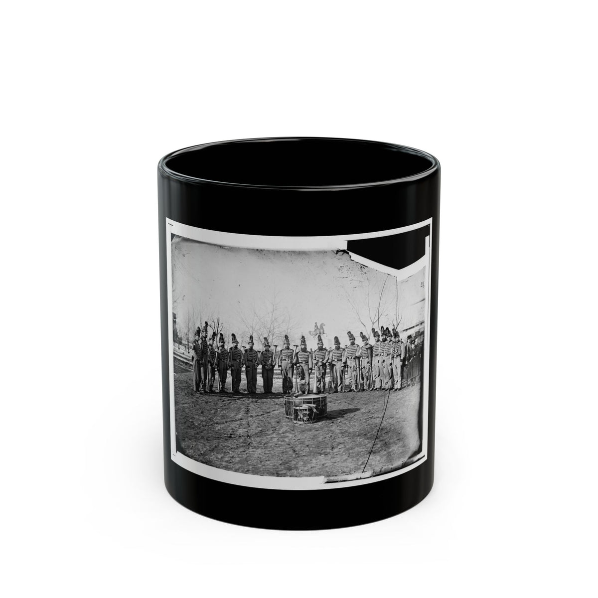 Black and white 1860s view of a uniformed band in plumed hats with brass horns, beside an equestrian statue.