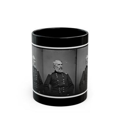 Black and white vintage triptych of one older bearded man in a dark military coat, repeated in three panels.
