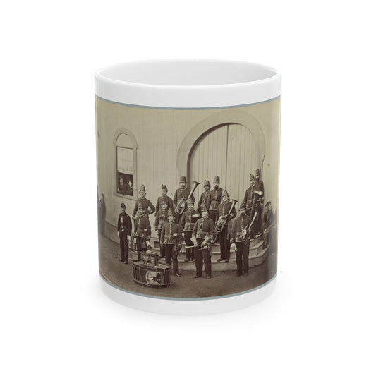 Sepia 19th-century view of a uniformed military band with brass instruments before an arched wooden doorway.