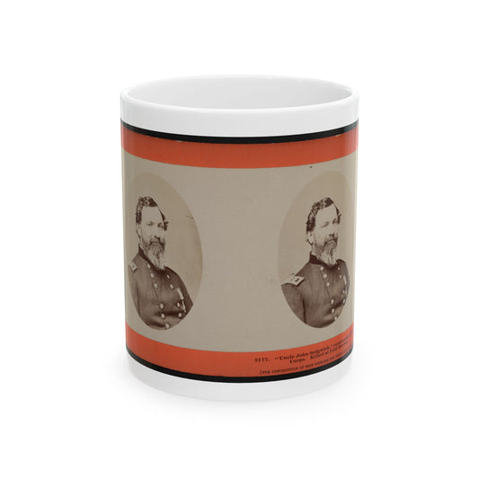 Stereoview card with two oval sepia portraits of a bearded Union officer in a buttoned uniform on an orange border.