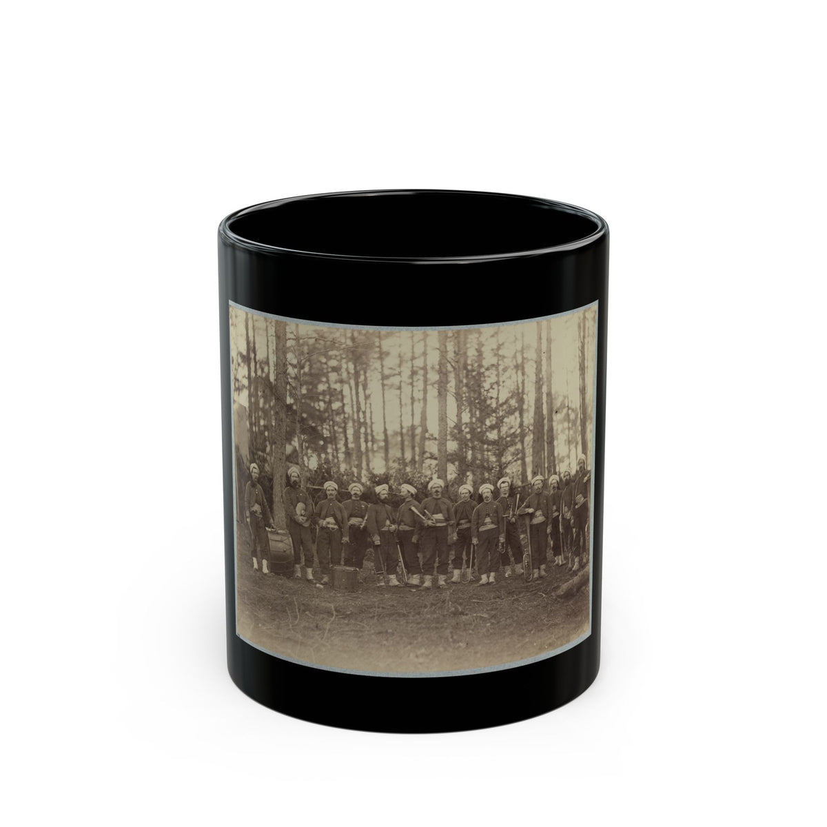 Sepia print of about fourteen uniformed musicians with drums and brass instruments among tall pine trees.