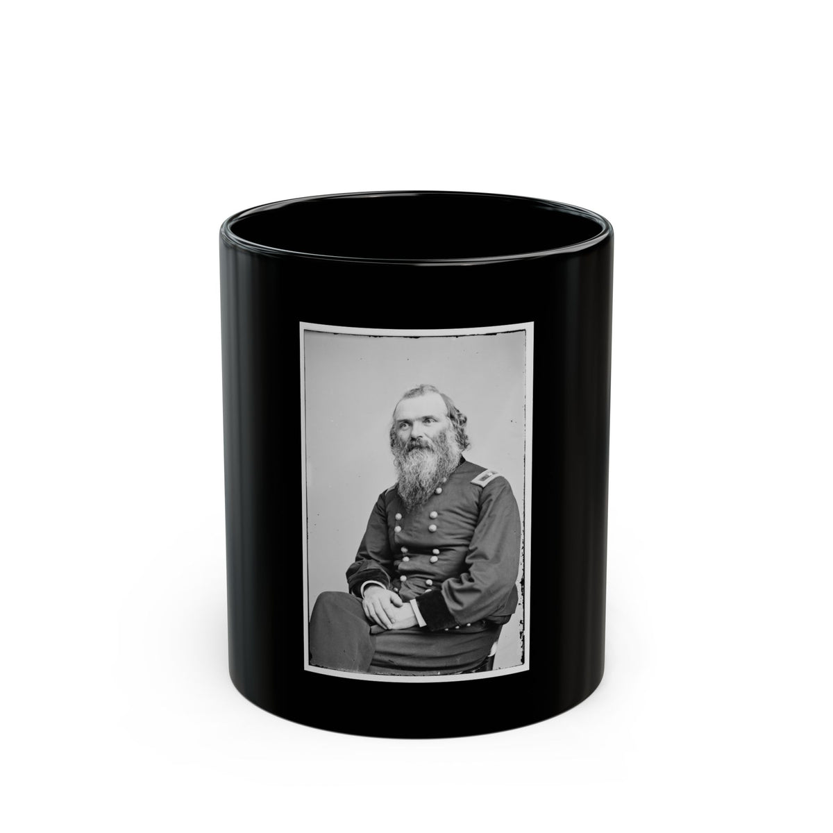 Black and white 19th-century studio portrait of a seated bearded man in a dark military uniform with hands clasped.