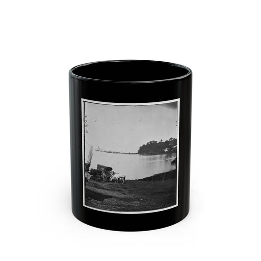 Black and white print of a white horse beside a covered mail wagon on a riverbank, with a steamboat.