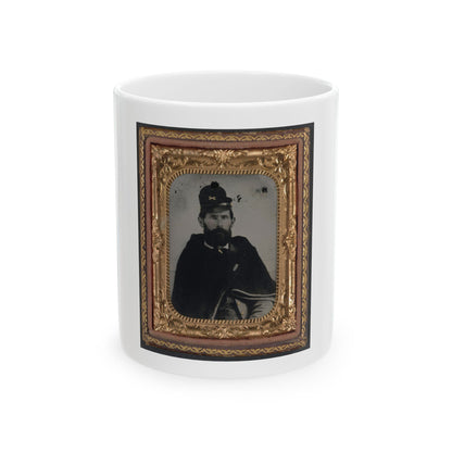 Antique tintype portrait of a bearded man in a dark cape and kepi, set in an ornate gilt case.