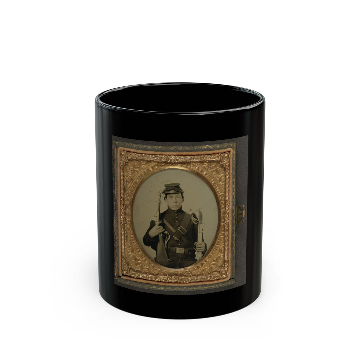 Antique tintype of a young soldier in a kepi holding a rifle and curved sword, in an oval embossed gilt frame.