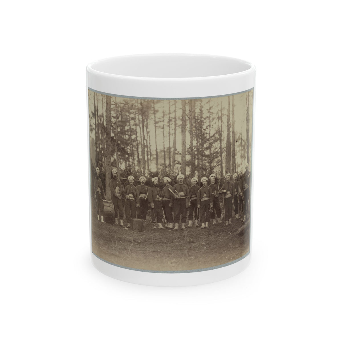 Sepia print of about fourteen uniformed musicians with drums and brass instruments among tall pine trees.