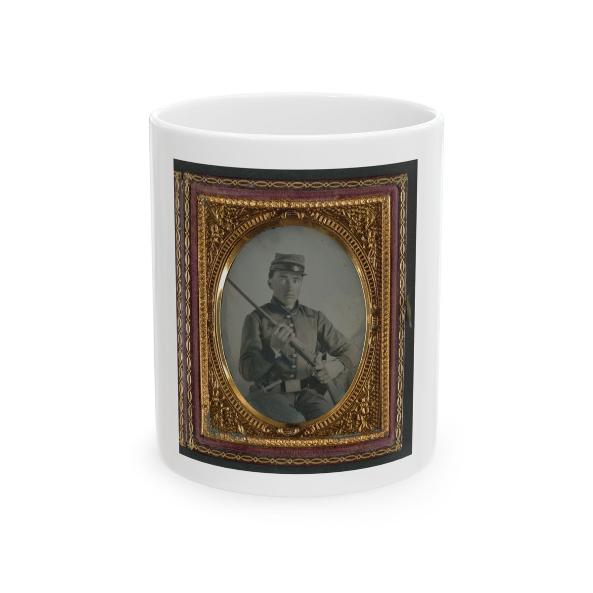 Hand-tinted tintype of a young soldier in a kepi holding a rifle diagonally across his body, in a gilt oval case.