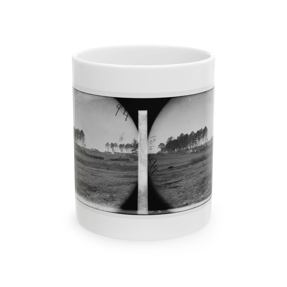 Black-and-white stereo pair of small tents among pine trees across a broad, bare, grassy field.