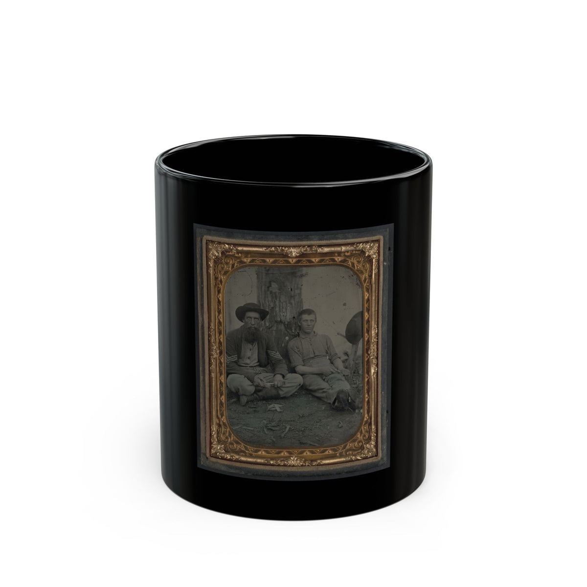 Antique tintype of two men seated outdoors by a tree, one in a wide-brimmed hat and one in shirtsleeves, in gilt.