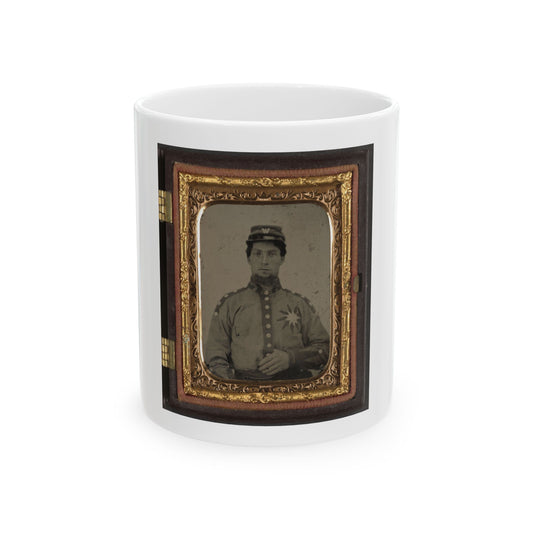 Vintage tintype of a soldier in a kepi marked with a W and a star badge on his jacket, in an ornate gilt case.