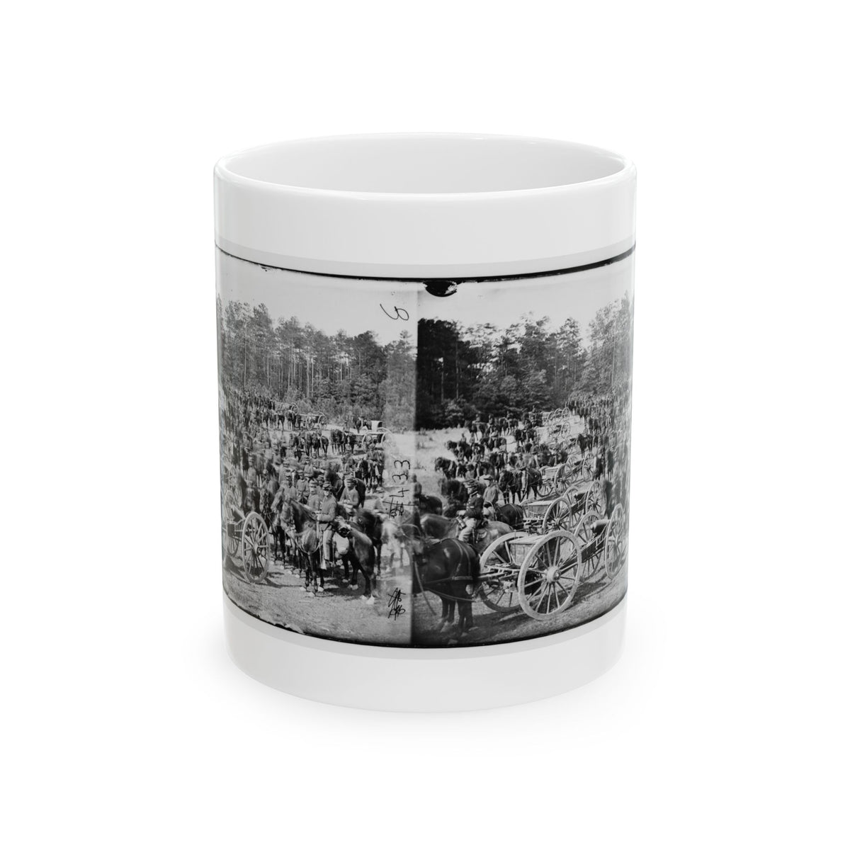Black and white stereograph of mounted riders, horses and artillery carriages gathered in front of a pine forest.