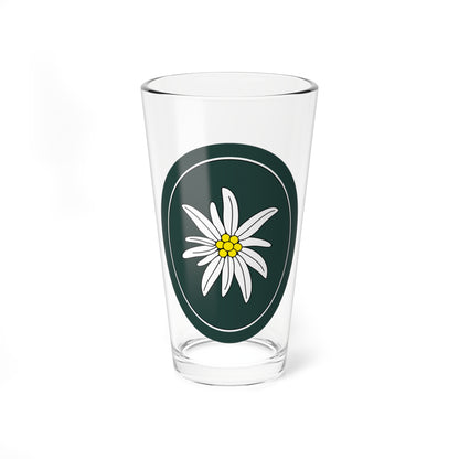 White edelweiss flower with a yellow centre on a dark green oval badge with a thin white inner ring.