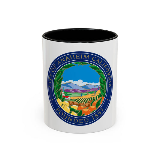 Navy circular seal of Anaheim showing citrus groves, a farmhouse and blue mountains, lettered around its rim.