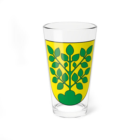Heraldic shield on yellow with a symmetrical green leafy branch growing from a green mound at its base.