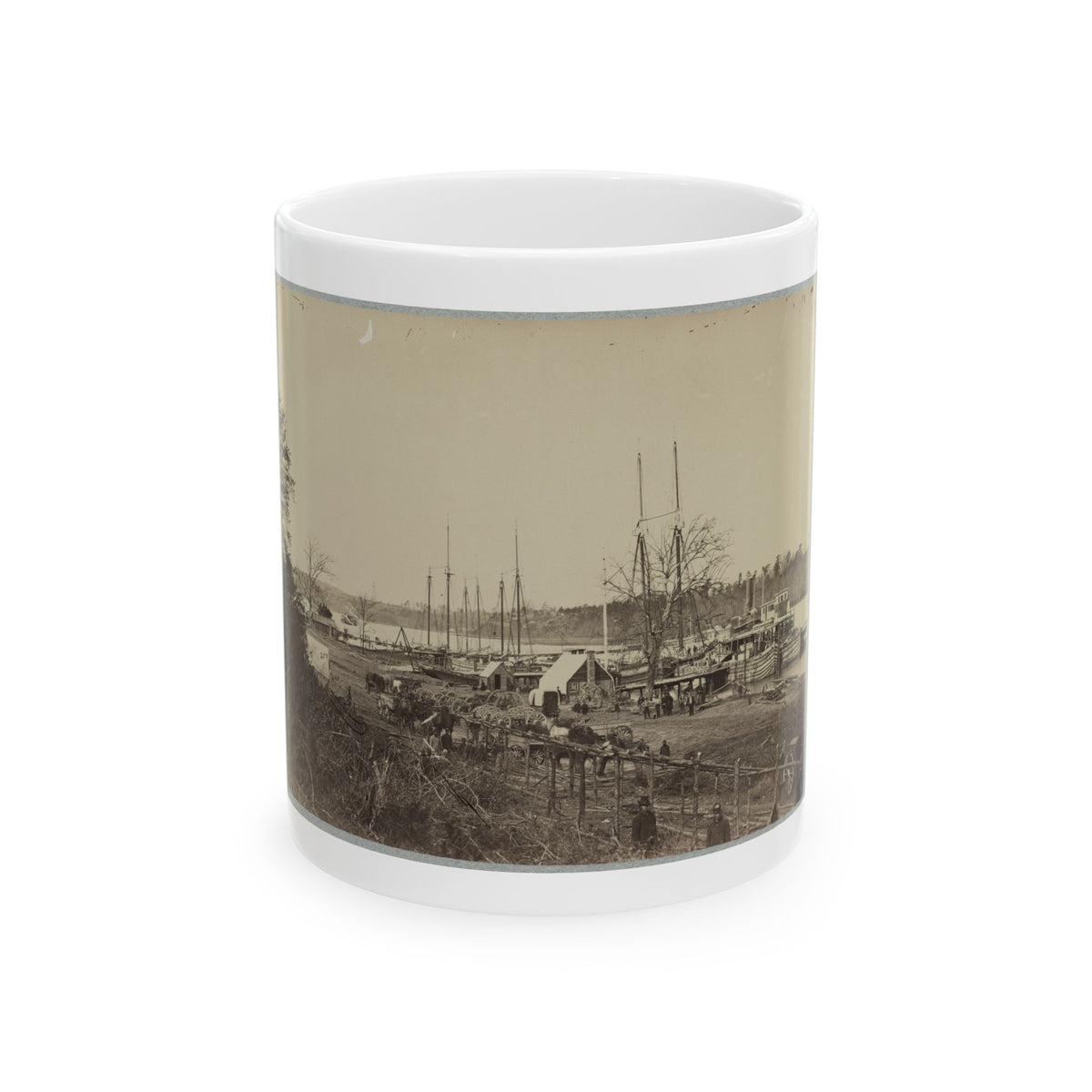 Sepia view of masted sailing ships and a paddle steamboat moored at a riverside landing with wagons on shore.