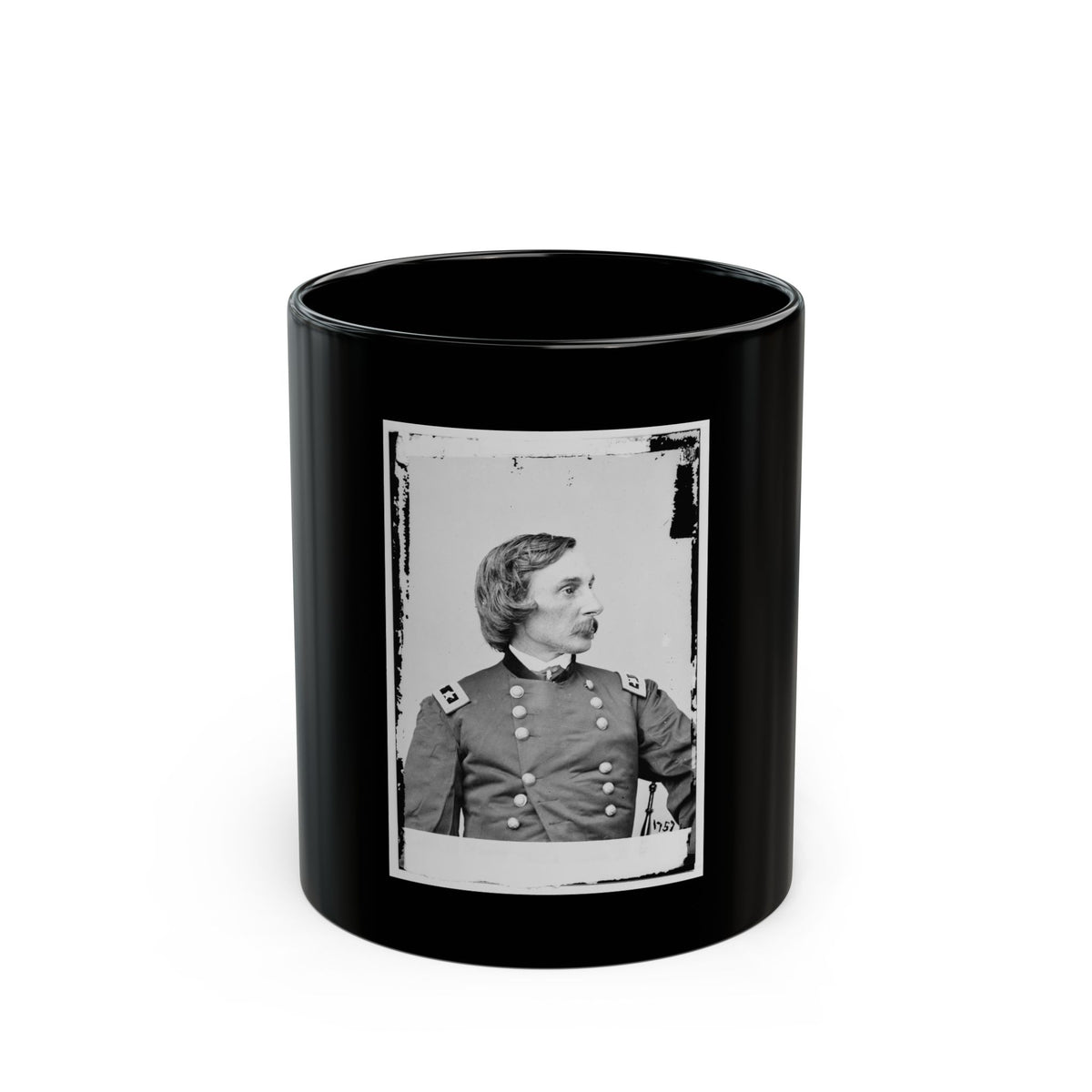 Black and white vintage portrait of a moustached officer in profile, in a double-breasted uniform with high collar.