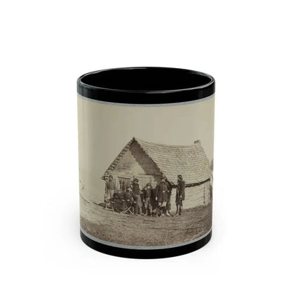 A Group Of Soldiers, And Two Young Men, One An African American, Stand Outside Of Log Cabin Quarters (U.S. Civil War) Black Coffee Mug 11oz - Go Mug Yourself