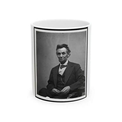 Abraham Lincoln, Three-Quarter Length Portrait, Seated And Holding His Spectacles And A Pencil (U.S. Civil War) White Coffee Mug-11oz-Go Mug Yourself