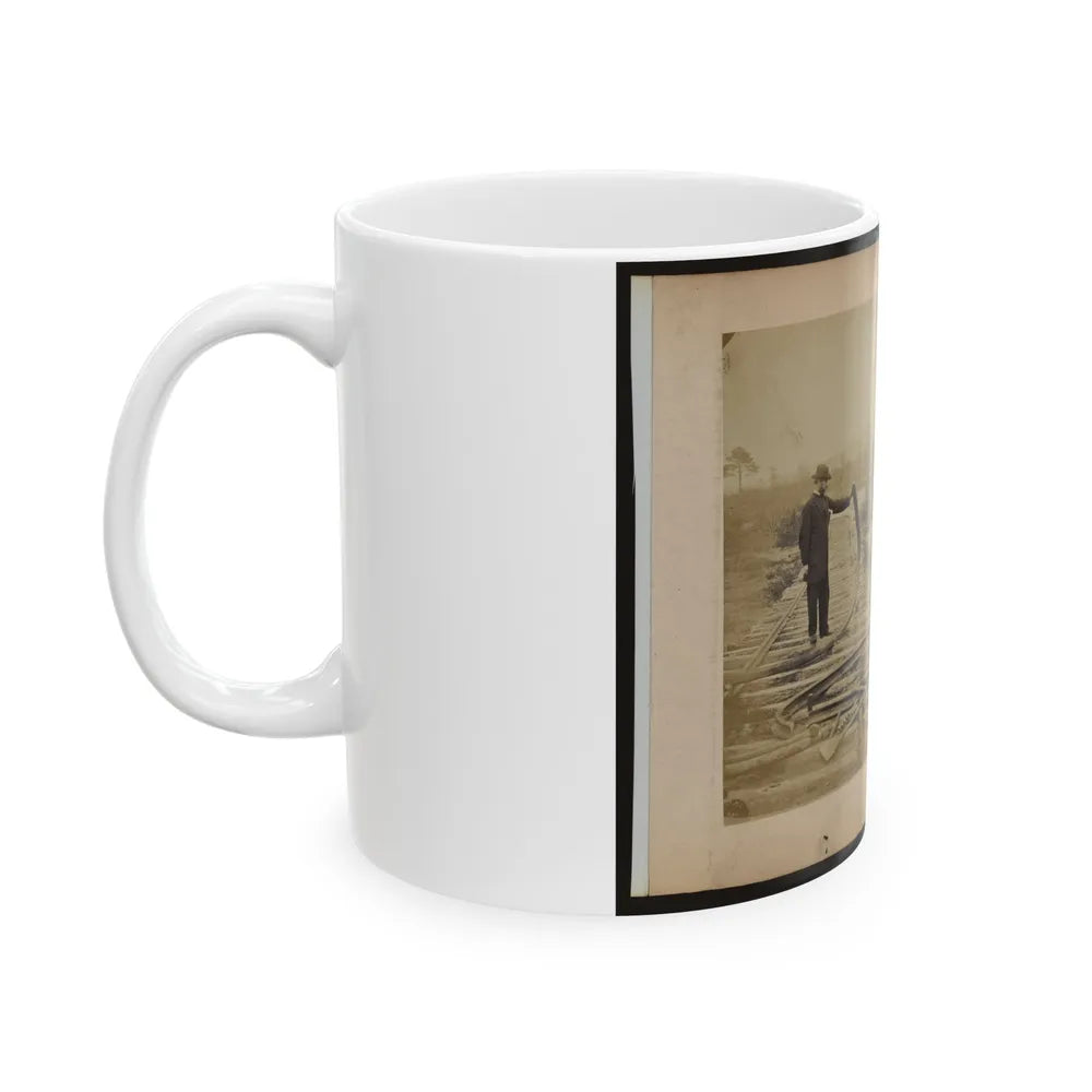 Military Railroad Operations In Northern Virginia Man Standing On Railroad Tracks Holding Twisted Rail (U.S. Civil War) White Coffee Mug-Go Mug Yourself