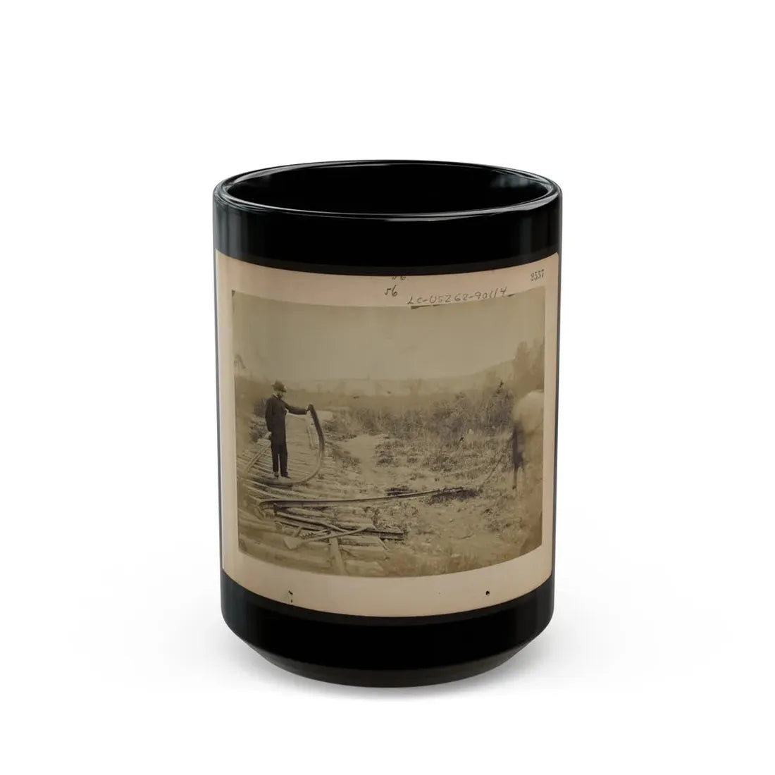 Military Railroad Operations In Northern Virginia  Man Standing On Railroad Tracks Holding Twisted Rail (U.S. Civil War) Black Coffee Mug 15oz - Go Mug Yourself
