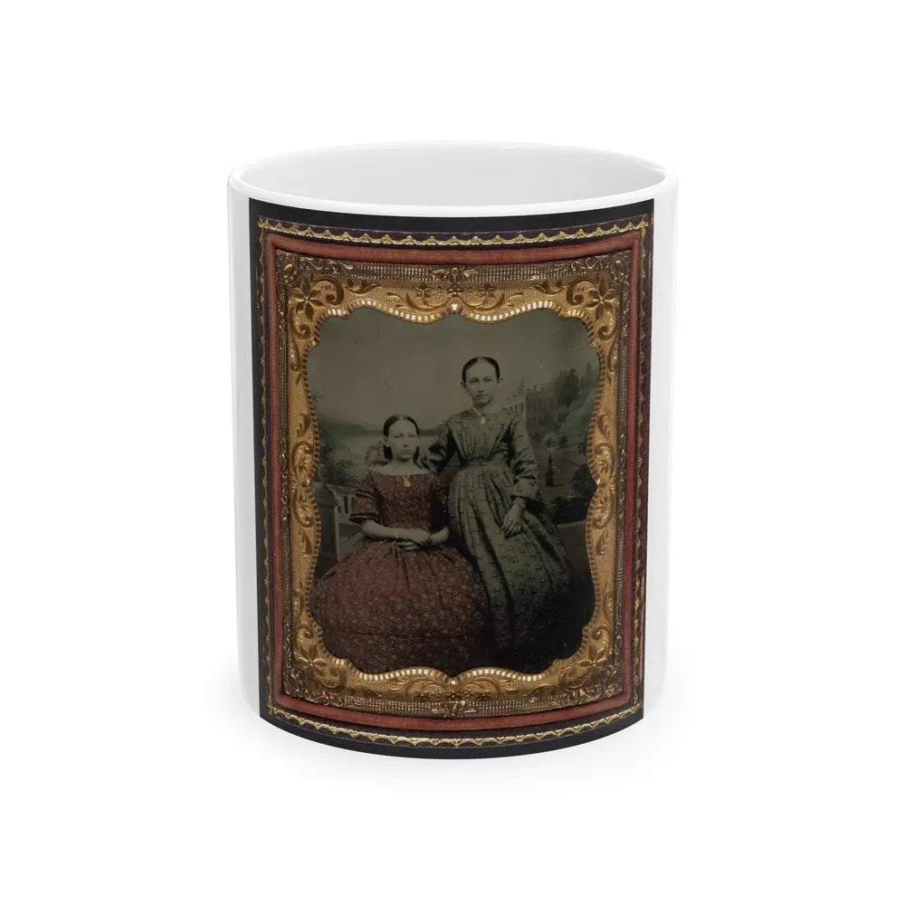 Two Unidentified Young Women Wearing Printed Dresses And Necklaces In Front Of Painted Backdrop Showing Plantation (U.S. Civil War) White Coffee Mug-11oz-Go Mug Yourself